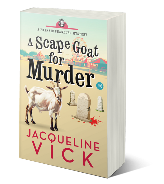 A light tan paperback cover with a fair in the background and several gravestones and a goat in the foreground. The title is A Scape Goat for Murder, a Frankie Chandler mystery, by Jacqueline Vick.